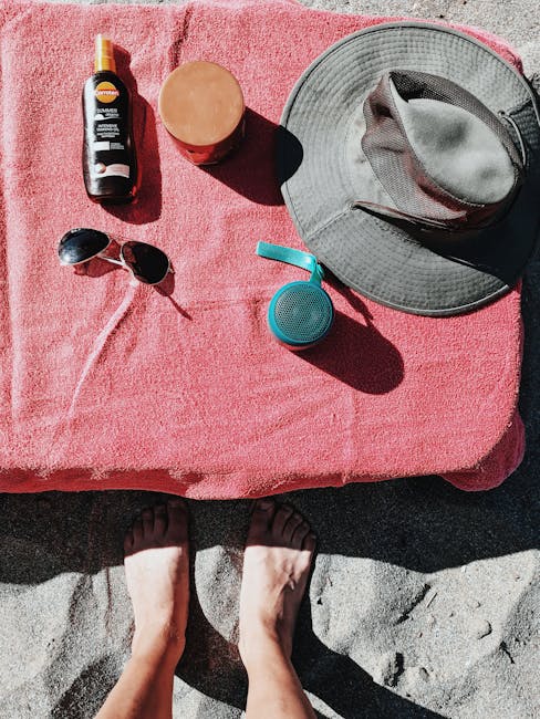 beach bag essentials sunscreen hat sunglasses