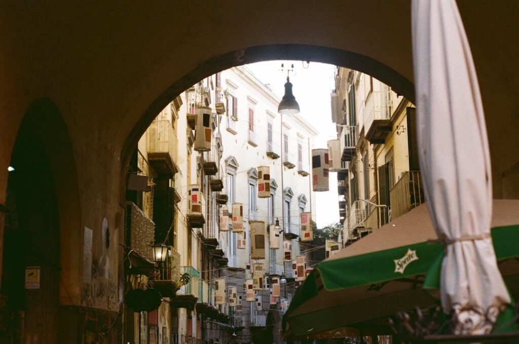 Naples narrow street pizza doorway
