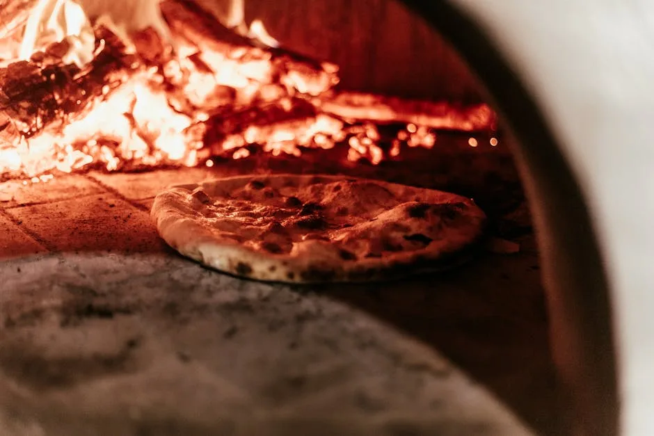 Neapolitan pizza baking inside a roaring wood-fired oven in Naples