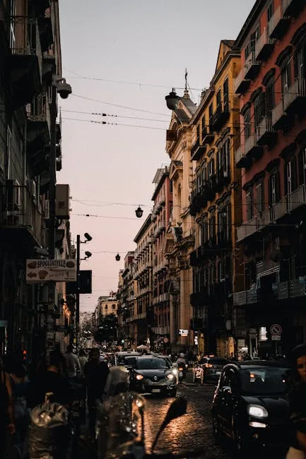 Naples narrow street evening lights