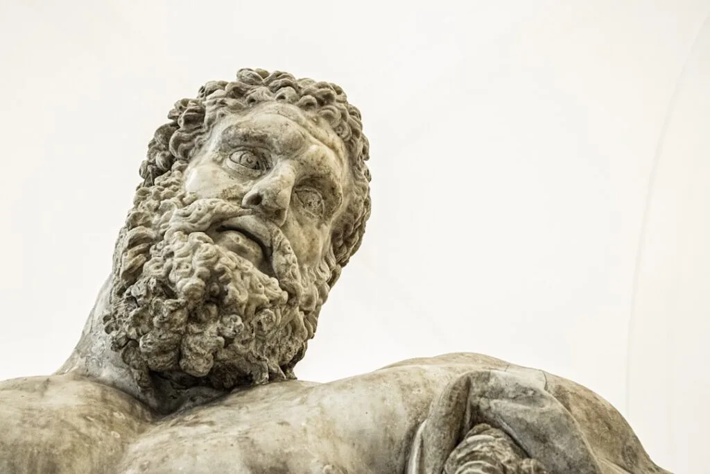 Close-up of ancient marble statue head displayed in a Naples museum