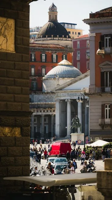 Piazza del Plebiscito view with basilica and statue in Naples