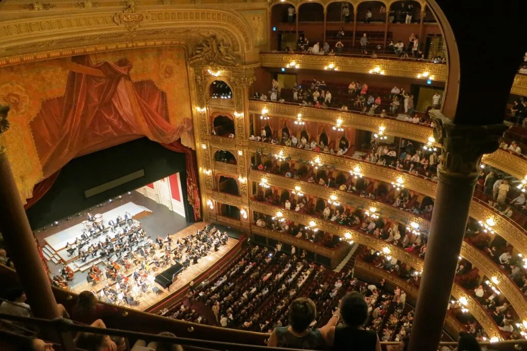 Interior view of Teatro di San Carlo auditorium with orchestra and audience