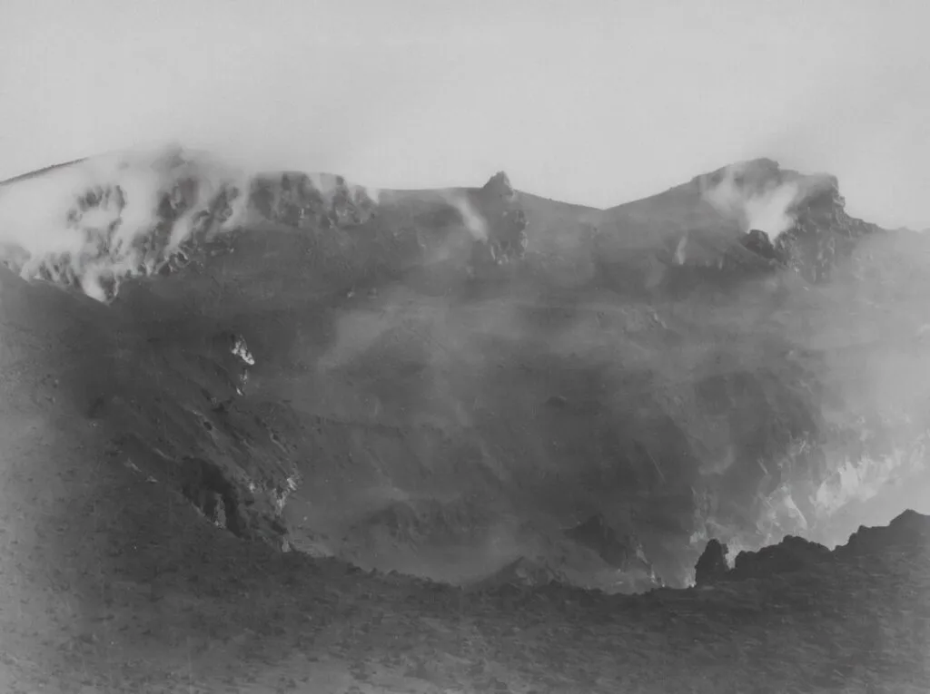 Mount Vesuvius crater rim shrouded in steam and volcanic ash near Naples