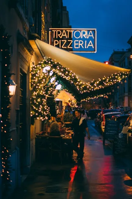 Evening Naples street with trattoria pizzeria sign and festive lights