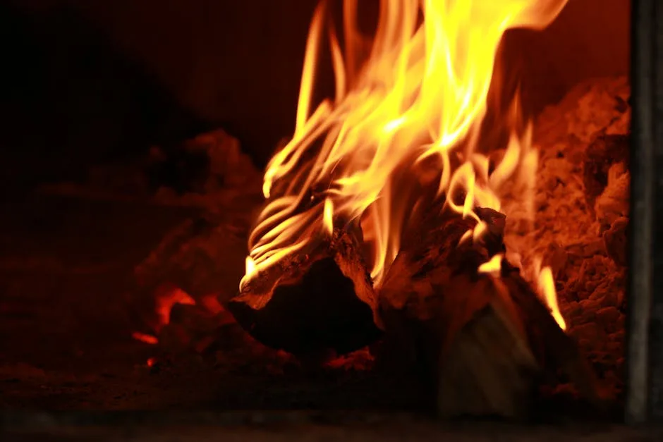 Bright yellow flames curling around wood inside a Naples pizza oven