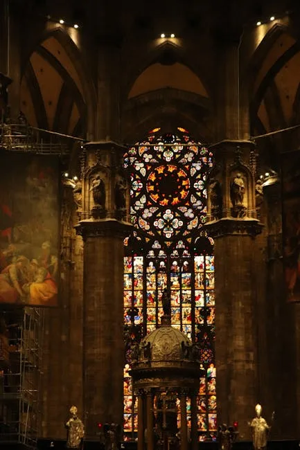 Interior of Naples cathedral with tall columns and stained-glass window