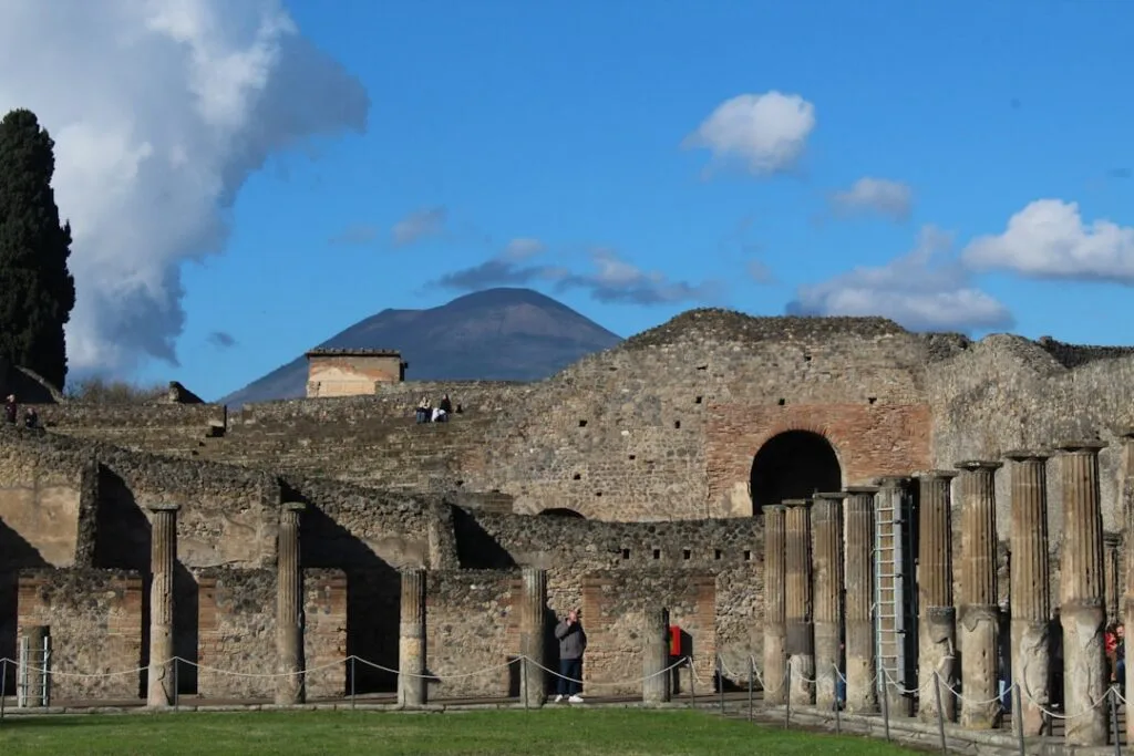 Ancient Pompeii ruins with Mount Vesuvius rising behind, near Naples