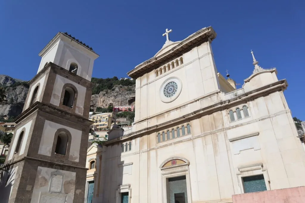 Cathedral facade and bell tower in Amalfi under clear blue sky