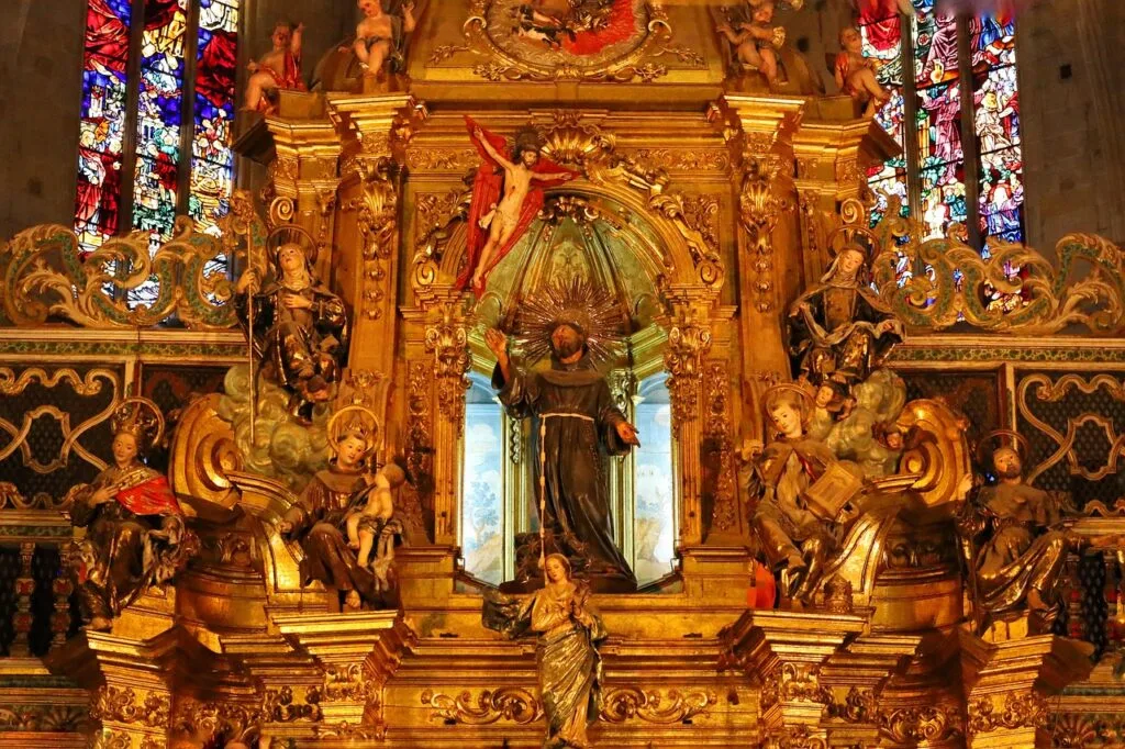 Gilded Baroque altar with saint statues and stained glass, Naples