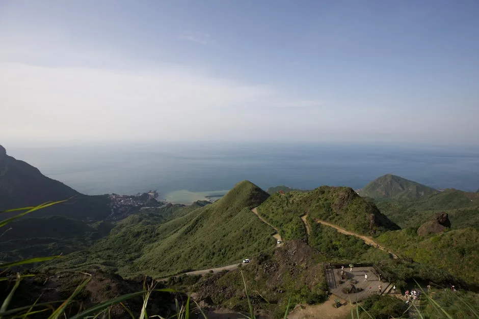 Winding trail across green Ischia hills overlooking the Tyrrhenian Sea